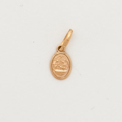 Gold pendant on a white background
