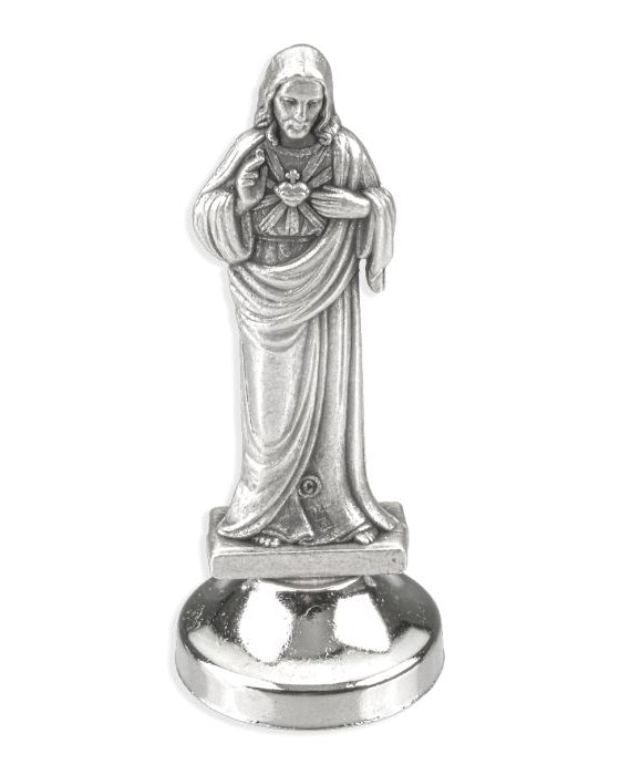 Silver statue of a religious figure on a white background