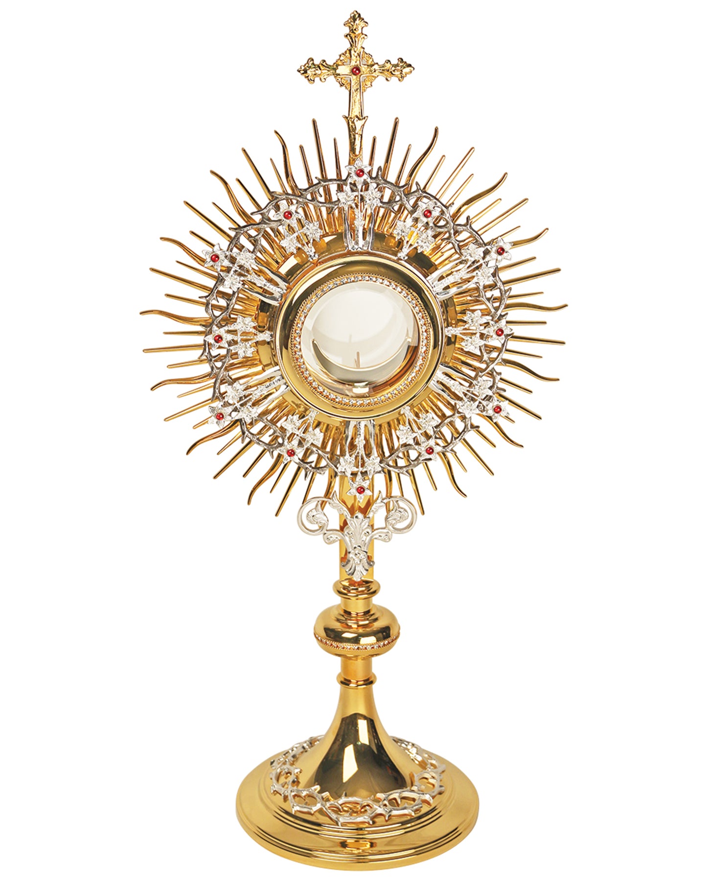 Gold monstrance with a relic on a white background