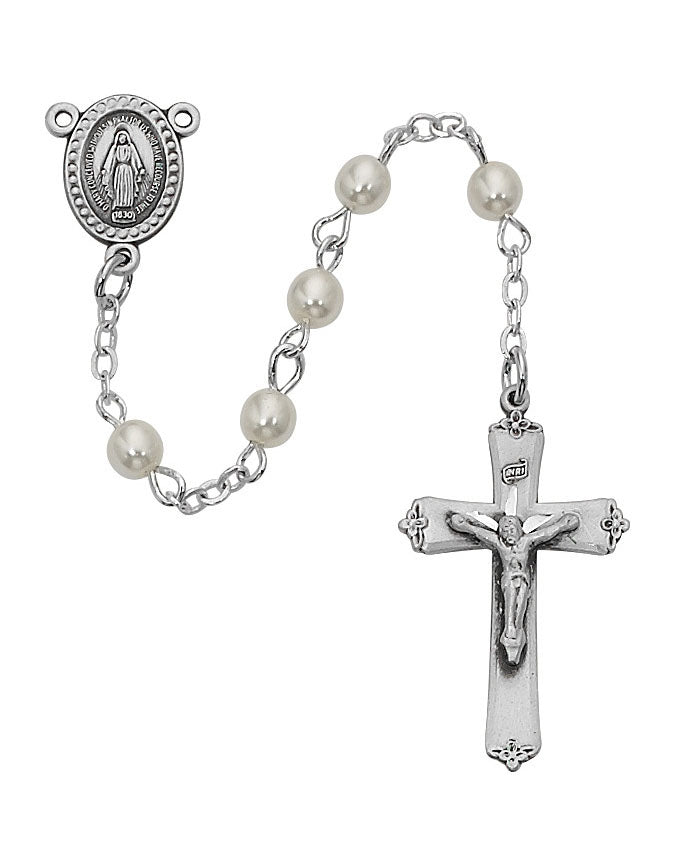 Silver rosary with pearl beads on a white background