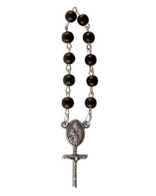 Black rosary with silver cross on a white background