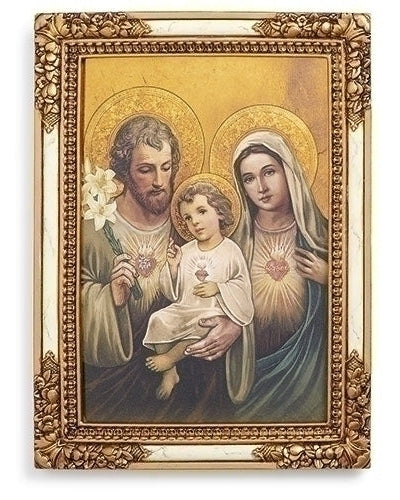 A framed picture depicting the Holy Family with the Chaste Hearts of Joseph, Mary, and baby Jesus, in a gold and ivory color scheme.