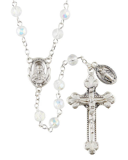 A silver-colored metal rosary with clear glass beads, featuring a silver crucifix and centerpiece, along with a miraculous medal.