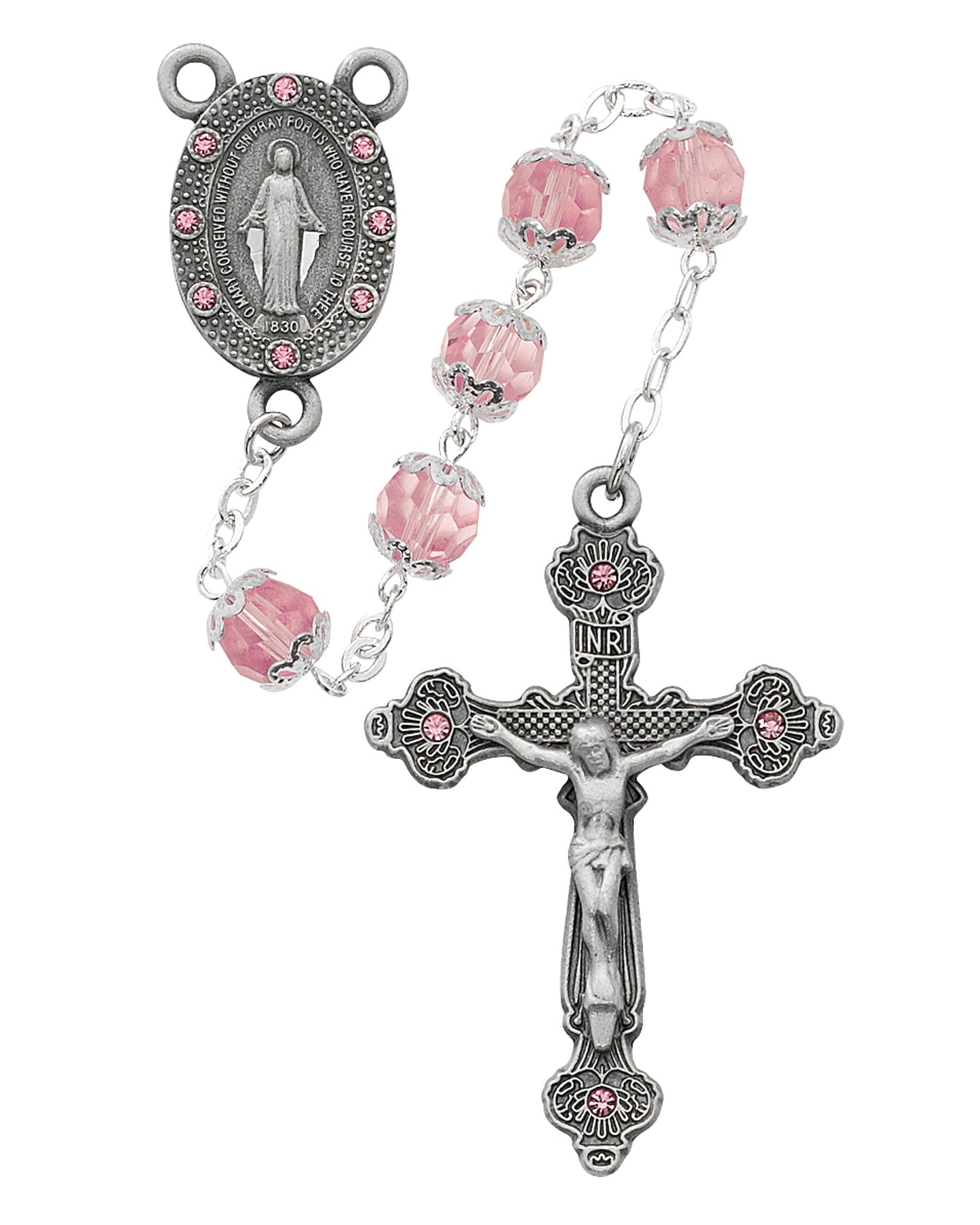 Rosary with pink beads and silver crucifix on a white background