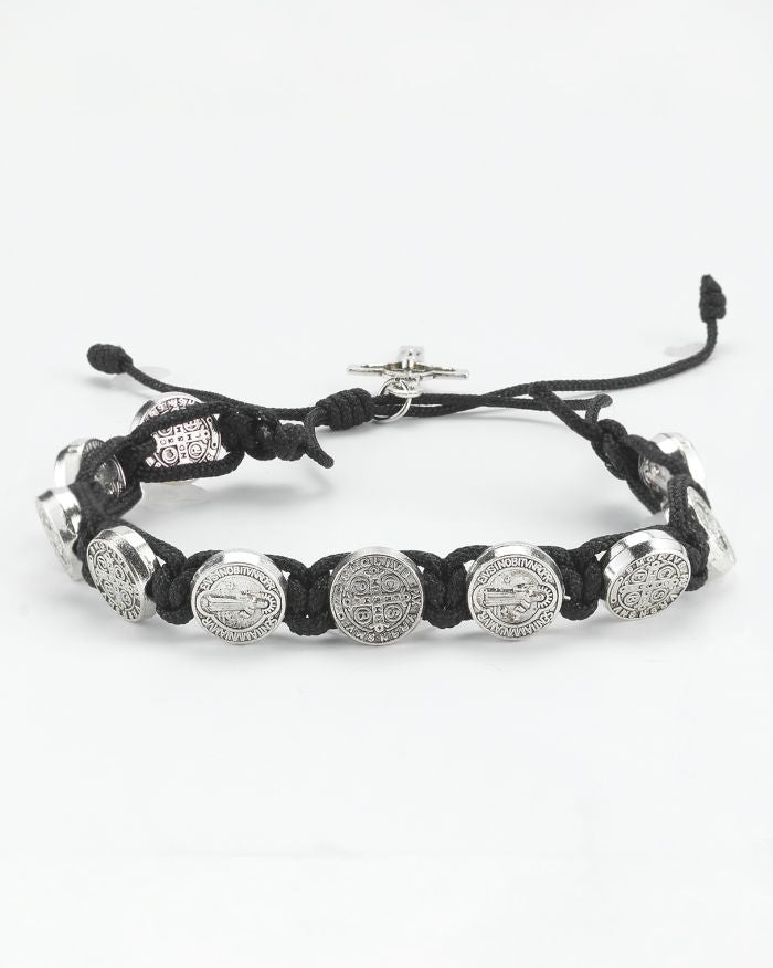 Black braided bracelet with silver beads on a white background