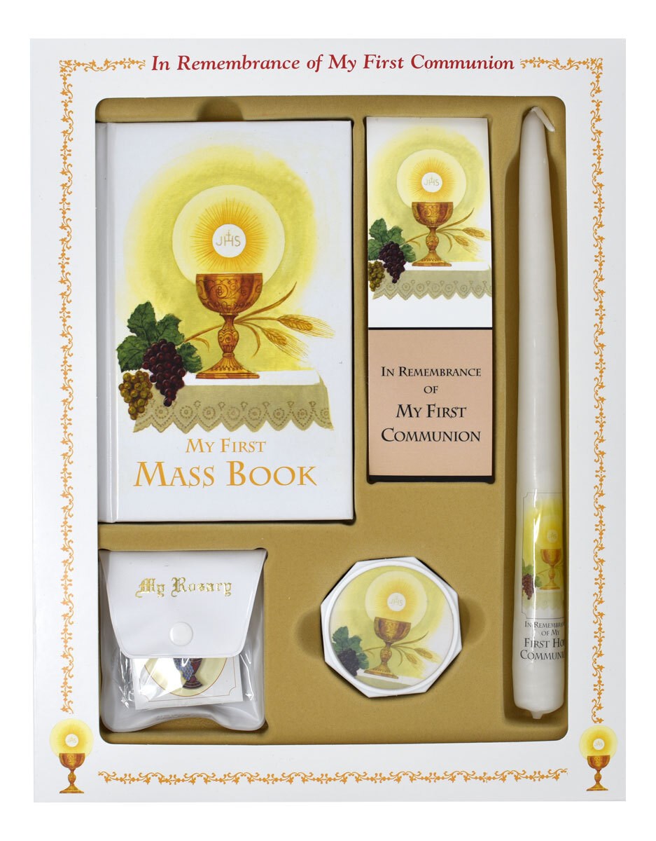 First Communion gift set with Mass Book, candle, and other items in a decorative box.