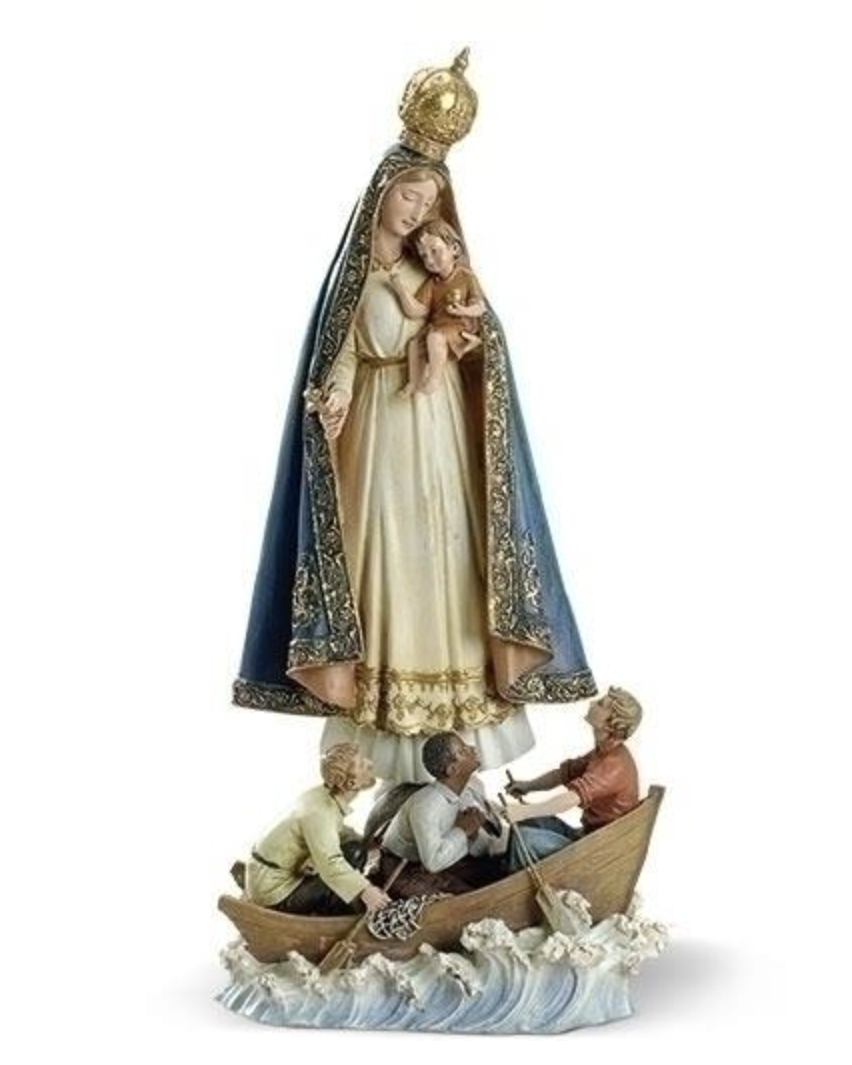 Statue of a religious figure holding a child on a boat with other figures, on a white background