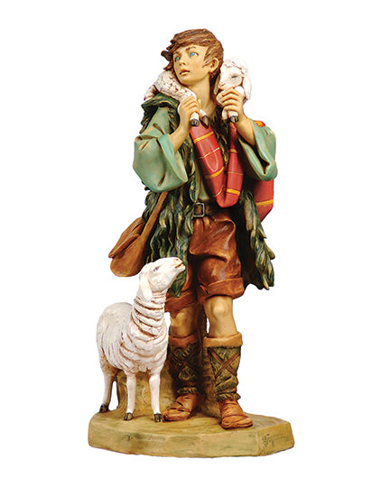 Statue of a shepherd with a sheep on a white background