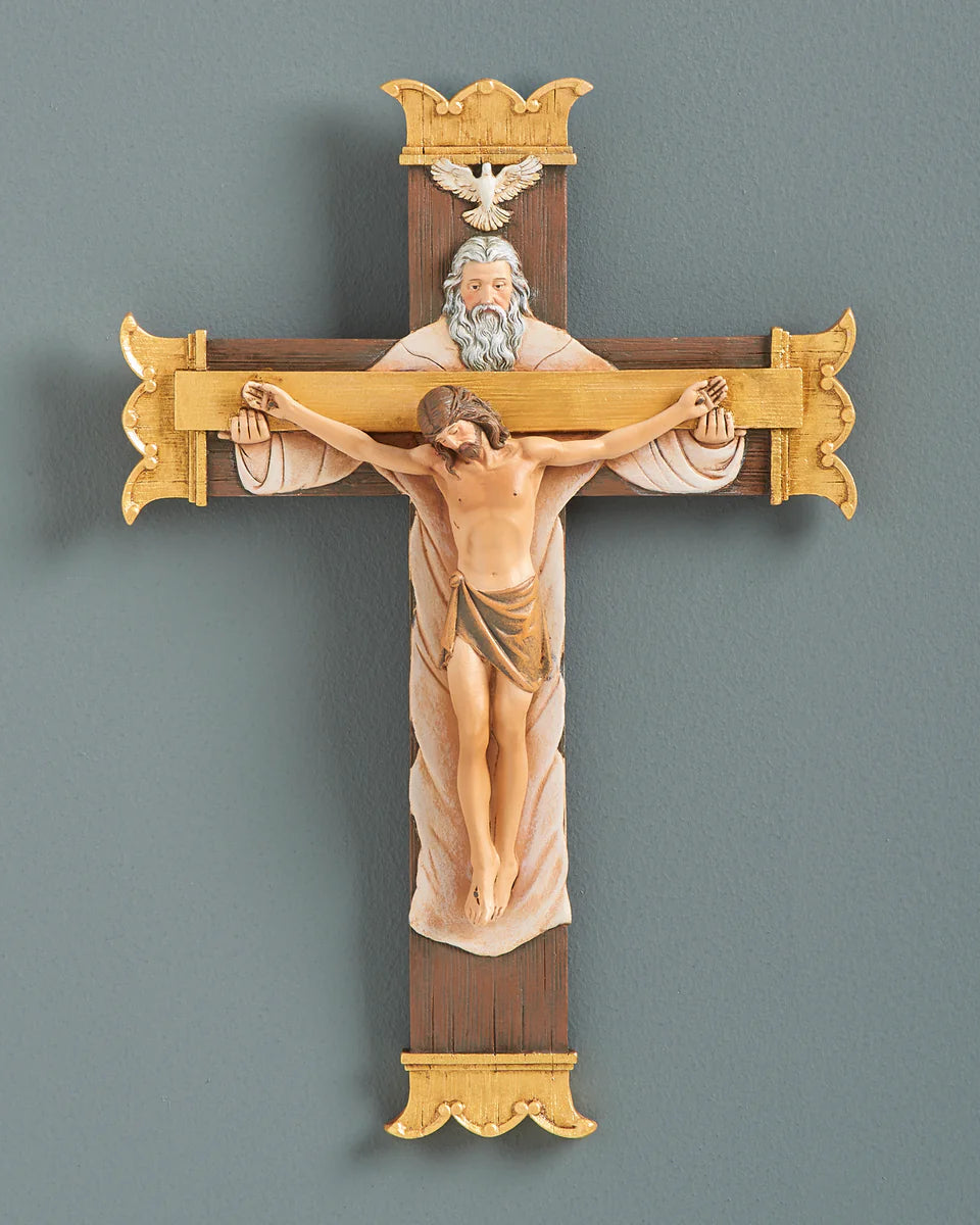 Decorative crucifix with religious figures on a gray background