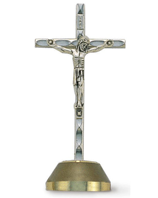 Silver crucifix with a gold base on a white background