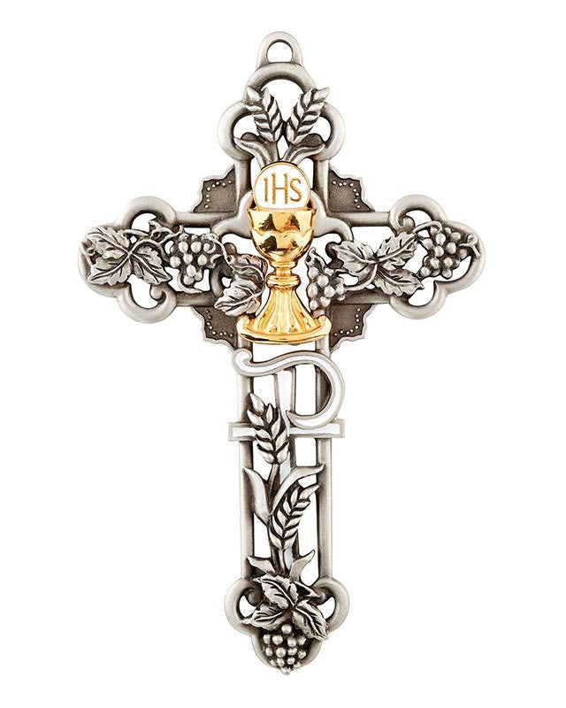 Decorative cross pendant with chalice detail on a white background