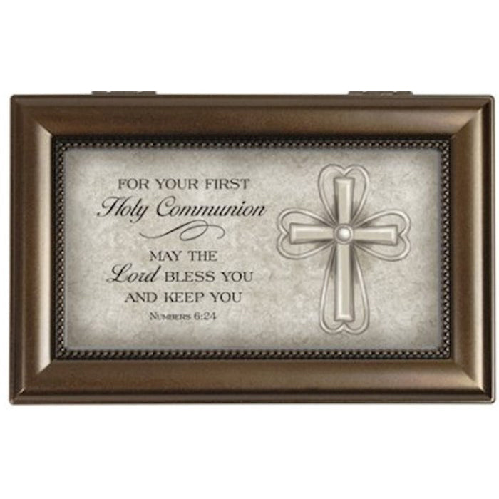 Decorative box with religious text and cross design on a white background