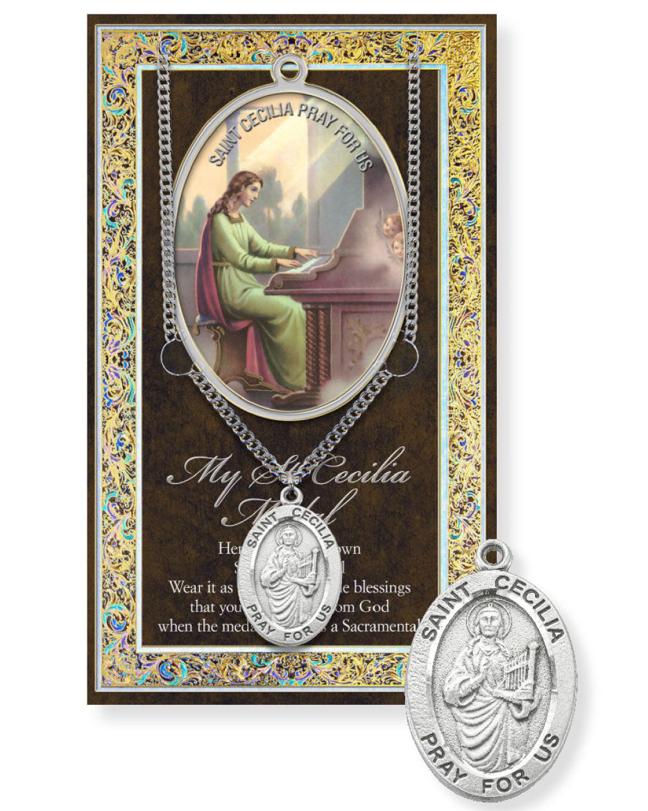 St. Cecilia pendant necklace with prayer card on a white background