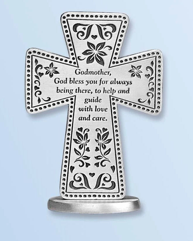 Decorative cross with engraved text on a light blue background