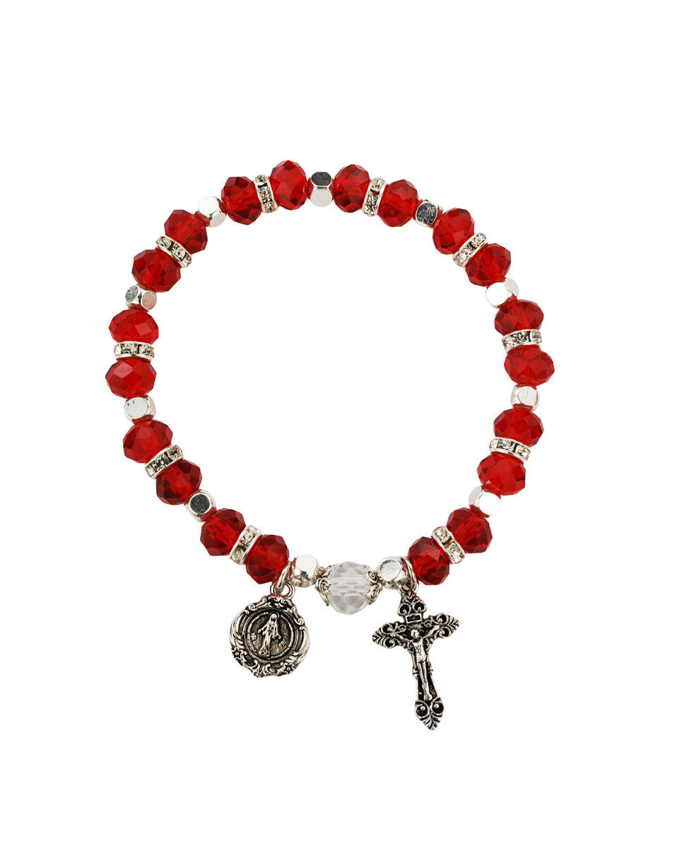 Red beaded bracelet with a cross and round charm on a white background