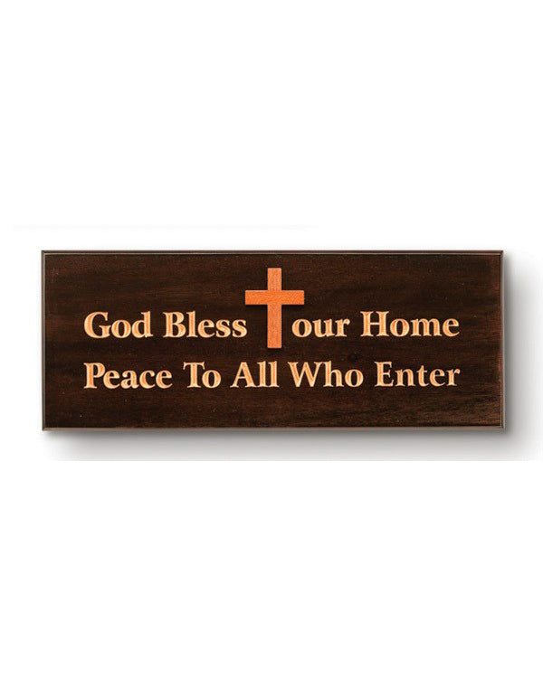 Wooden sign with cross and engraved text on a white background
