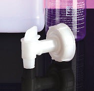 White plastic faucet on a black background