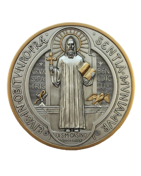 Decorative coin with religious figure and text on a white background