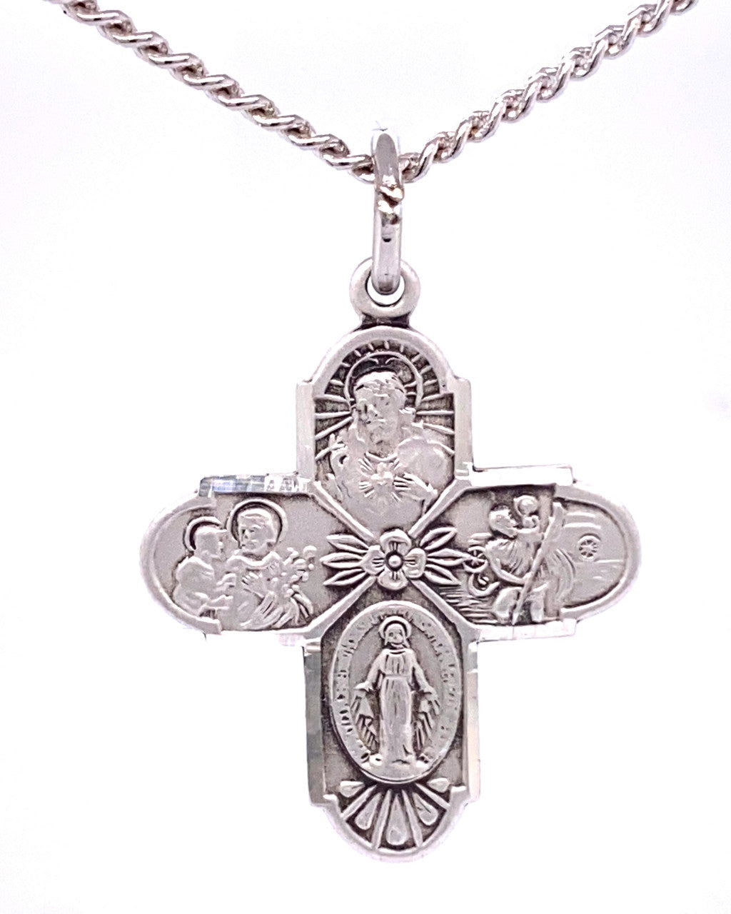 Silver cross pendant with religious figures on a white background