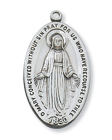 Silver medal with religious design on a white background