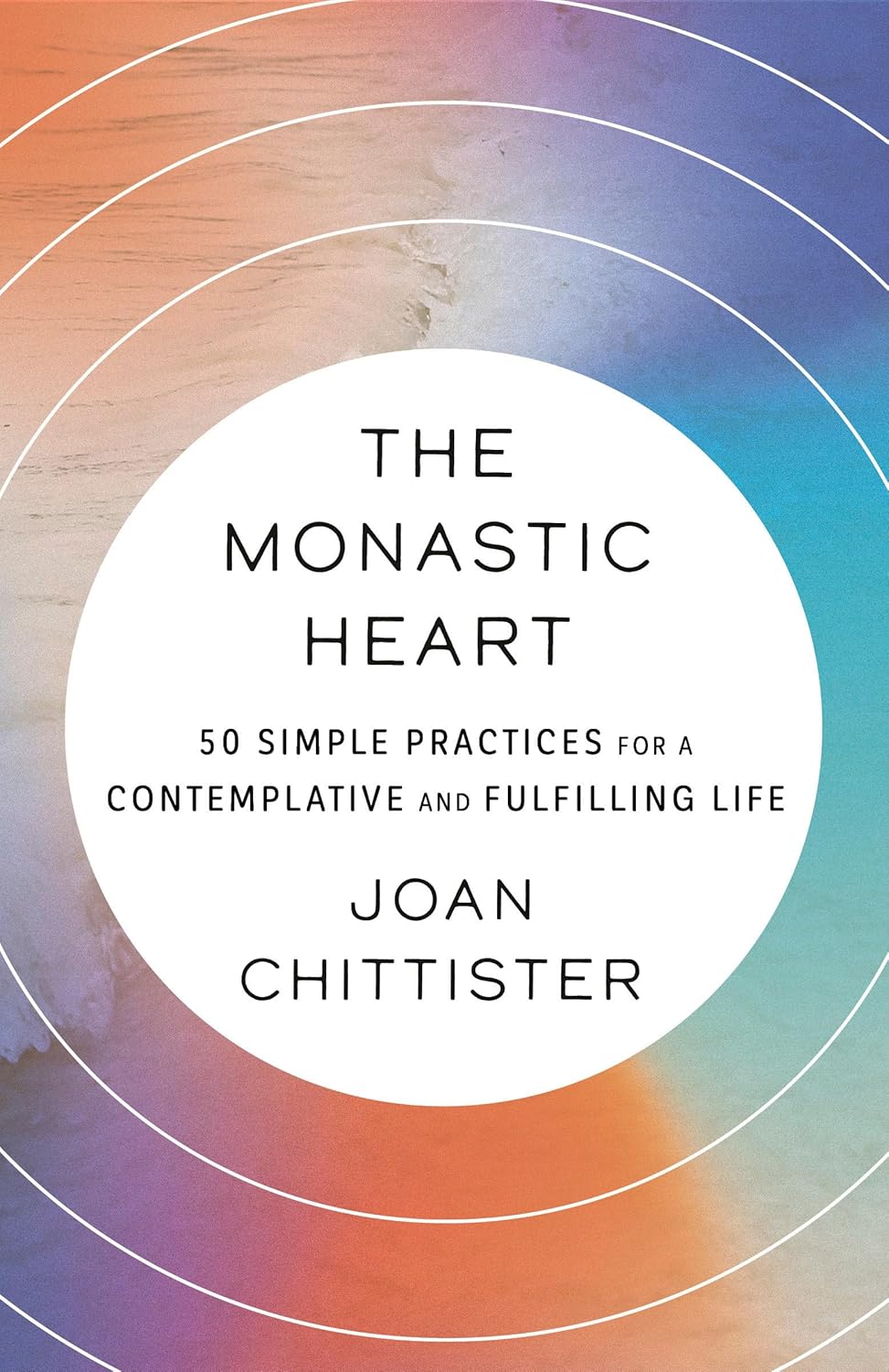 Book cover of 'The Monastic Heart' by Joan Chittister with a colorful circular design.
