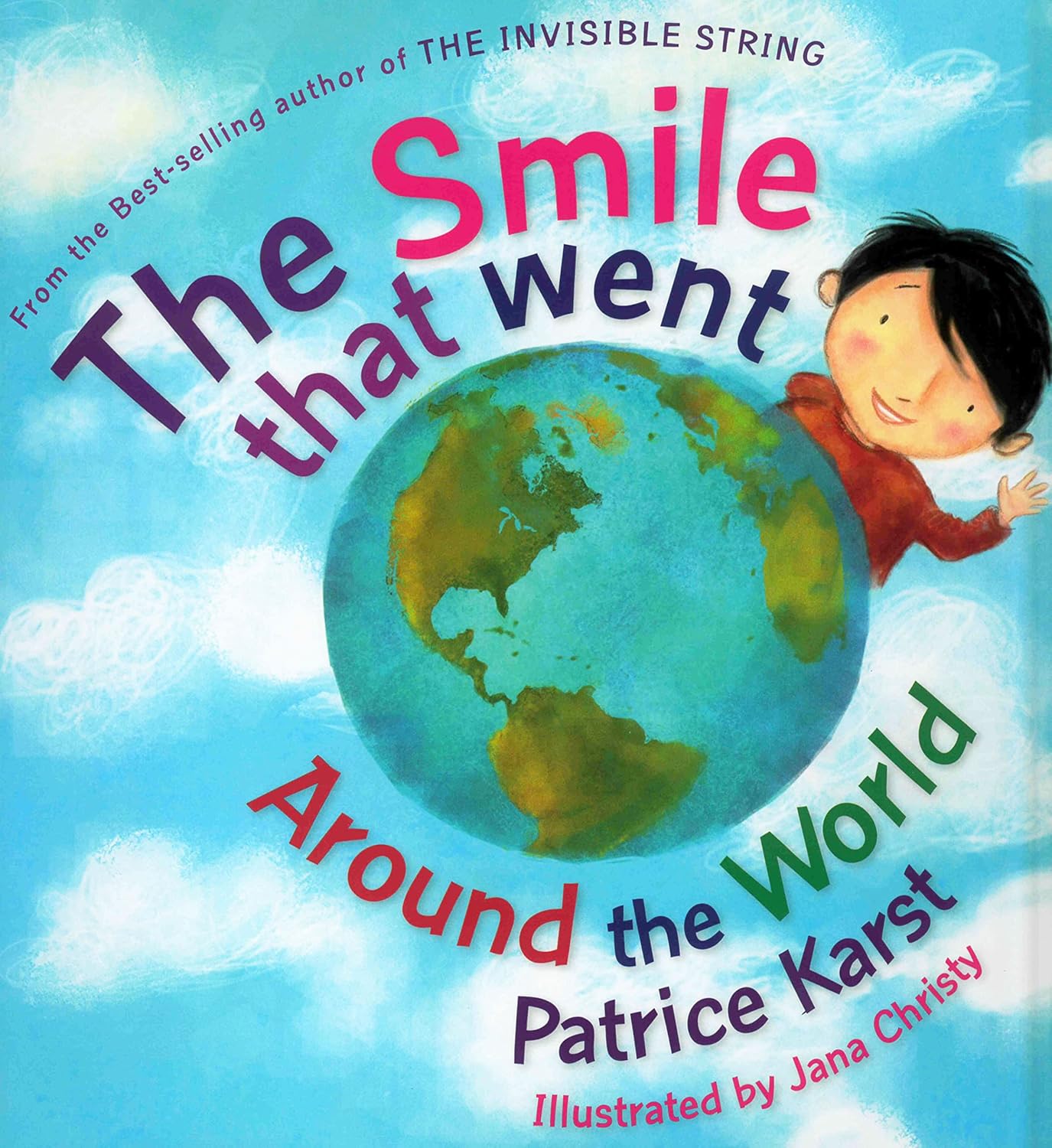 Book cover of 'The Smile that Went Around the World' with a child holding the Earth.