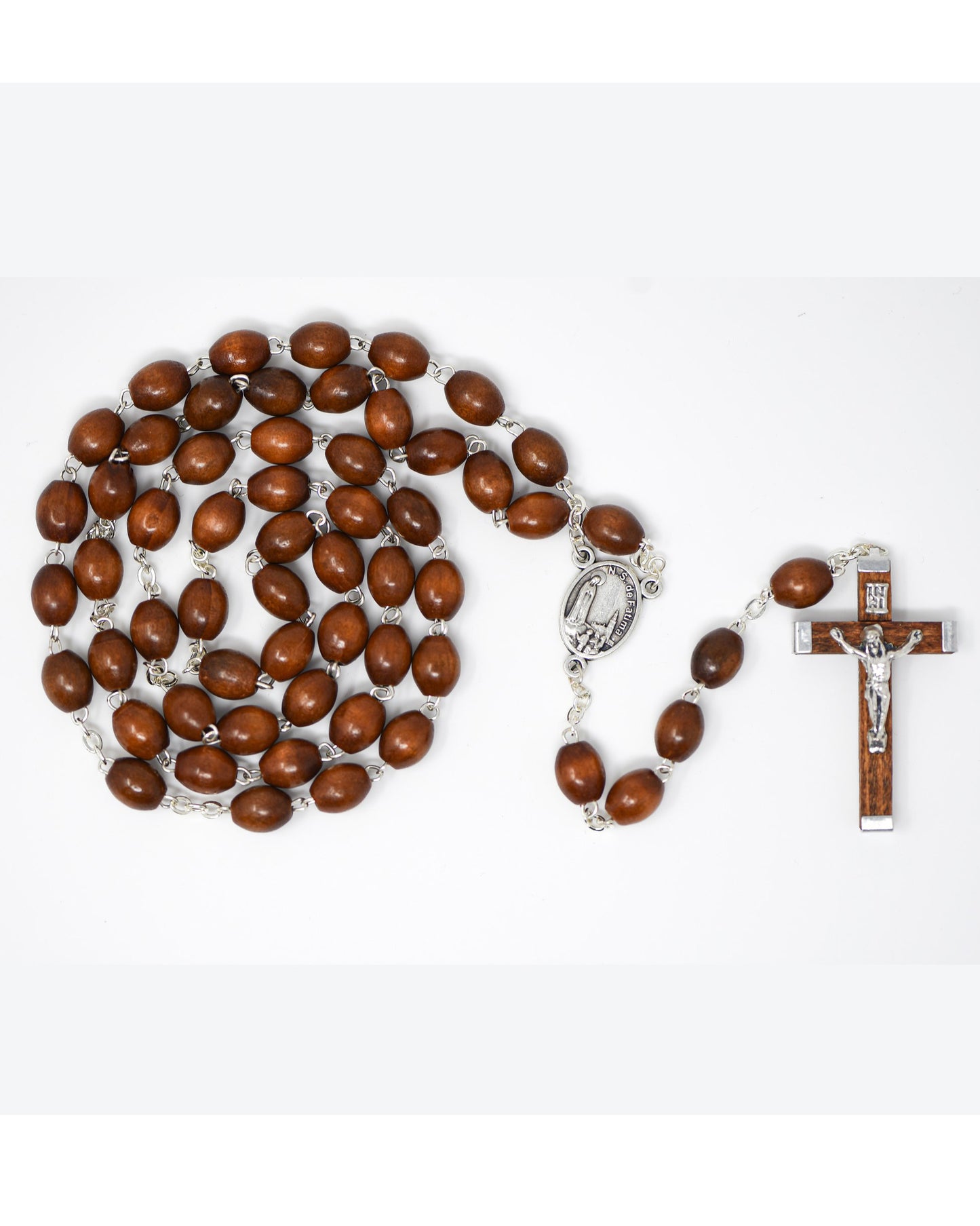 Wooden rosary with silver clasp and crucifix on a white background