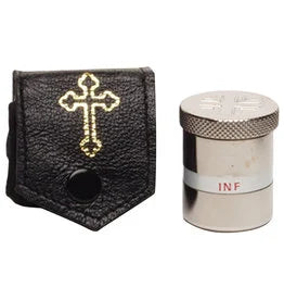 A black textured leather pouch with a gold cross emblem on the front, shown next to a silver cylindrical metal container with a knurled lid and a white band labeled 'INF'.