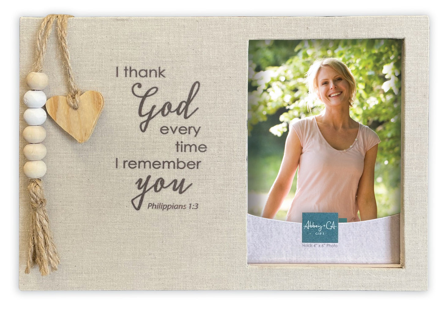 Decorative photo frame with text and a heart ornament, featuring a photo of a woman outdoors.