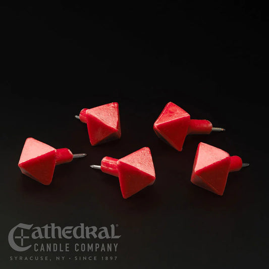 Red candle wick trimmers on a black background with Cathedral Candle Company branding.