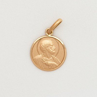 A small round 10K yellow gold medal featuring an image of Saint Peter.