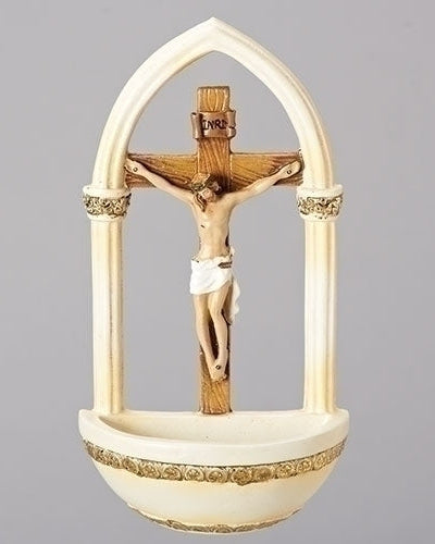 A florentine style gold-accented crucifix holy water font made of resin stone mix.