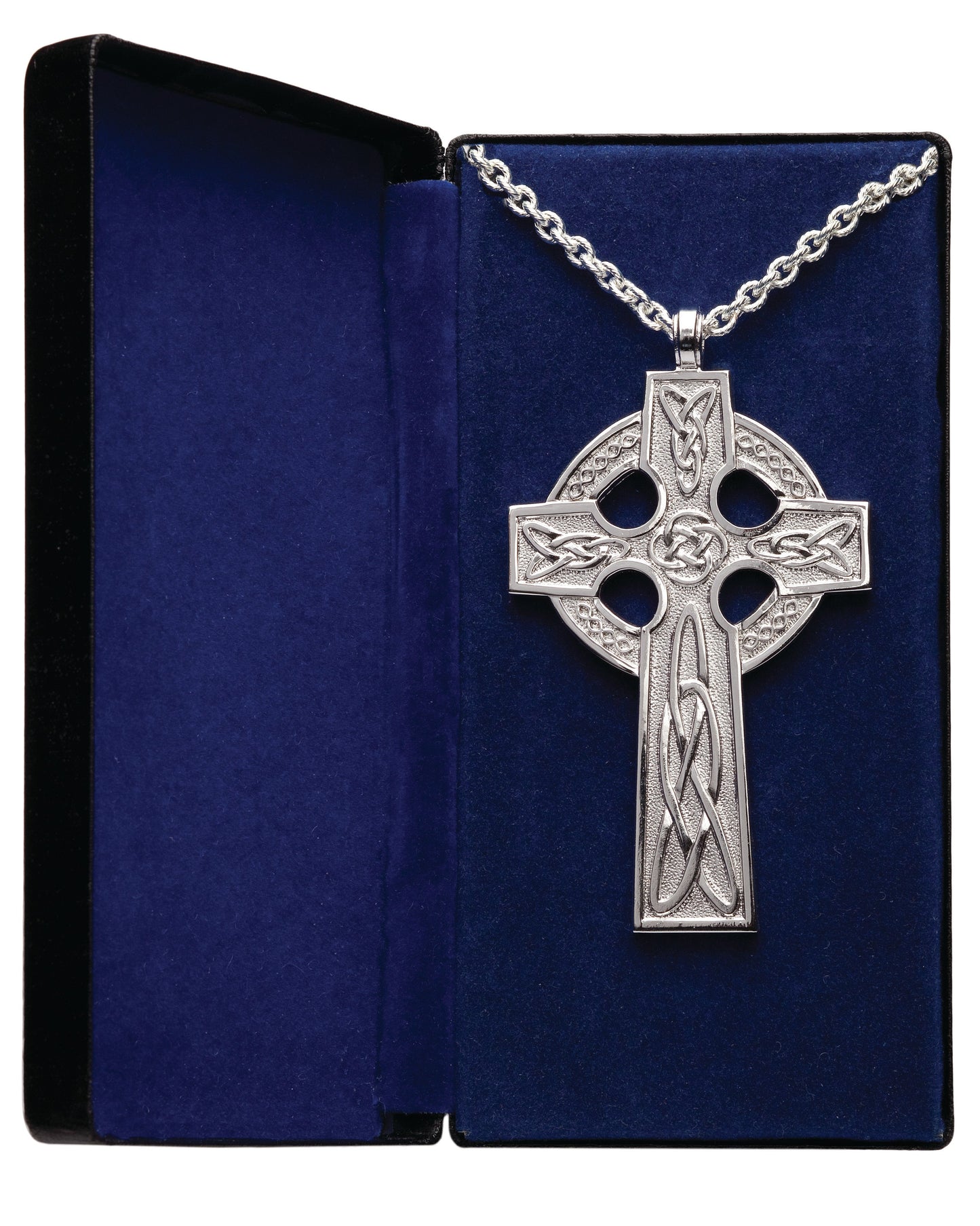 A silver-colored pectoral cross with a scroll design and amethyst stones, displayed on a blue velvet box with a chain.