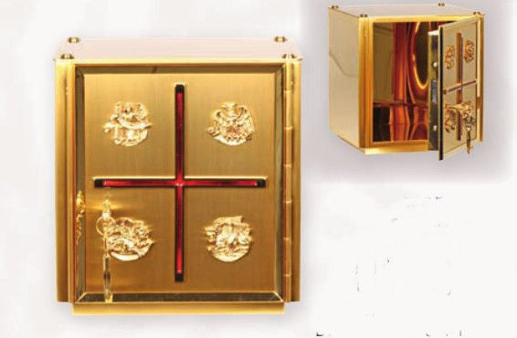 A gold-plated metal tabernacle with a red inlay cross and depictions of four evangelists, designed for use in a church.