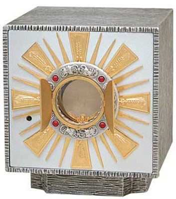 A tabernacle with silver and gold coloring, featuring 24K gold rays and four ruby stones, set against a white background.