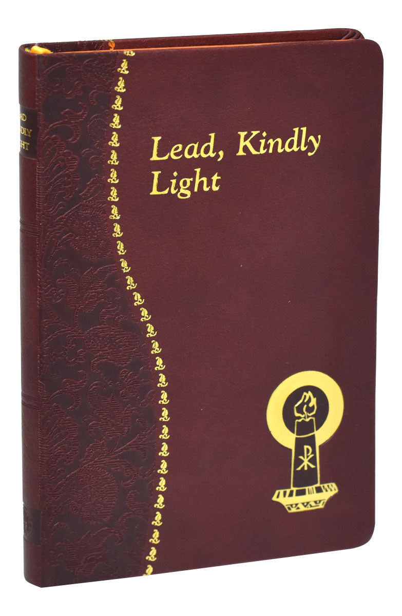 A burgundy leatherette book titled 'Lead, Kindly Light' with a symbol on the cover and a ribbon marker.