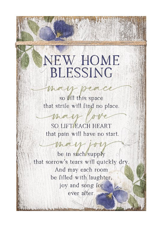 A wooden plaque with a floral design and a New Home Blessing message, featuring a metal hanger and twine trim.