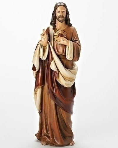 A statue of the Sacred Heart of Jesus, standing with his hands joined in front of him, wearing a brown robe with a white scarf.