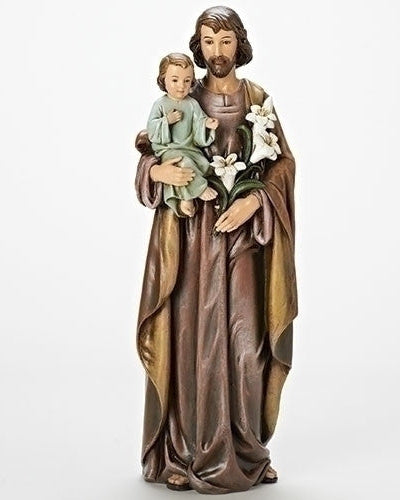 A statue of St. Joseph holding the Christ Child, depicted in brown, gold, and multicolored attire, with the Child in a blue garment.