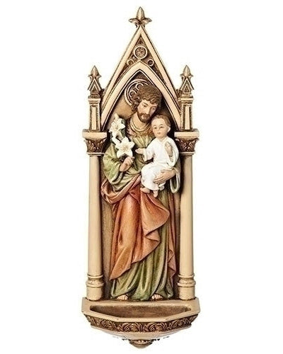 A resin statue of St. Joseph holding a child, designed as a holy water font with a rosary holder function.