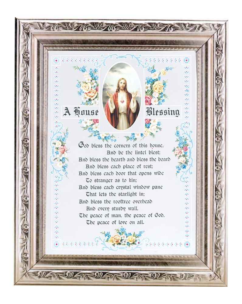 A silver-colored framed house blessing print with floral patterns and an image of a sacred heart within the frame.