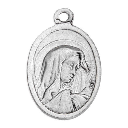 An oval silver-toned religious medal pendant featuring a profile portrait of the Virgin Mary, shown on a plain white background.