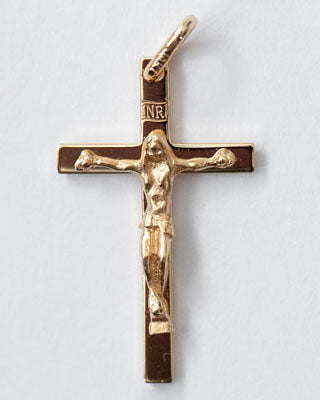 Gold crucifix pendant on a white background