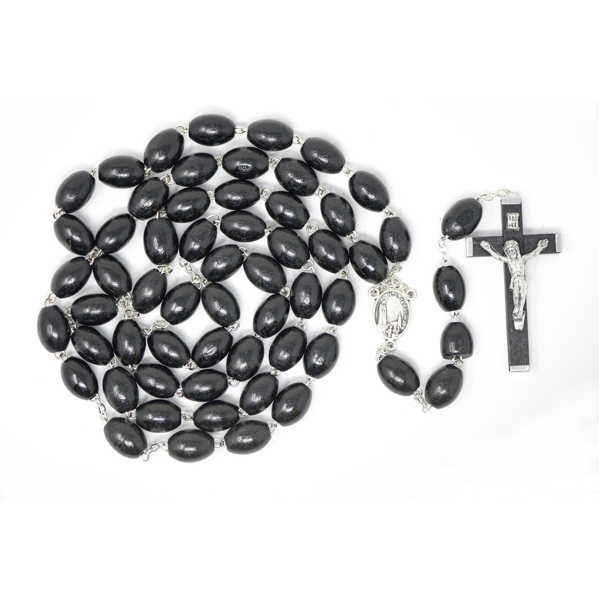 Black rosary beads with a crucifix on a white background