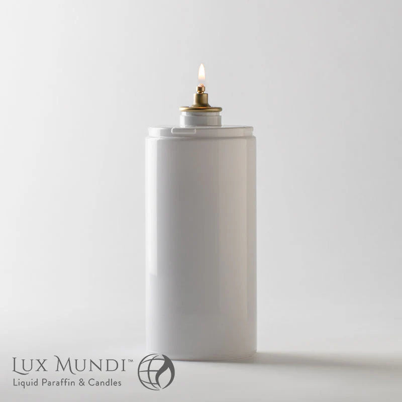 White container with a lit candle inside on a light gray background, featuring the Lux Mundi brand.
