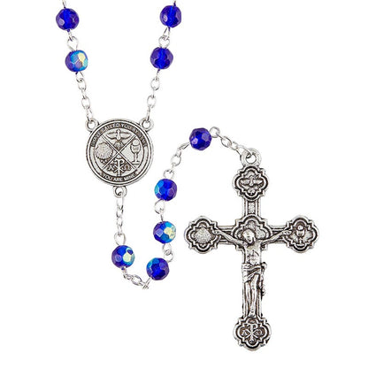 A silver-colored rosary with blue glass beads and a centerpiece featuring RCIA-themed symbols and a crucifix.