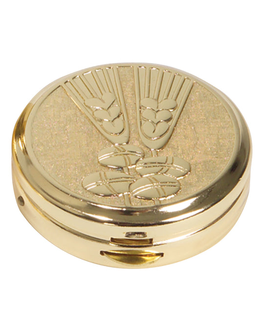 Gold compact mirror with decorative design on a white background