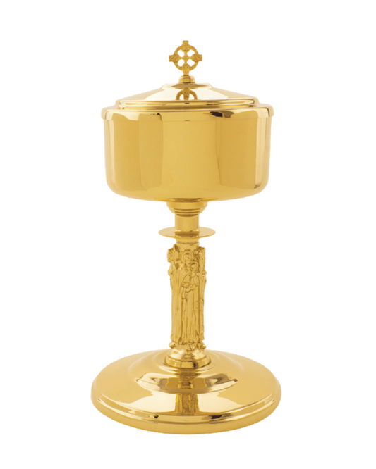 A polished gold-toned metal chalice with a lid and a sculpted stem featuring religious figures, isolated on a white background.