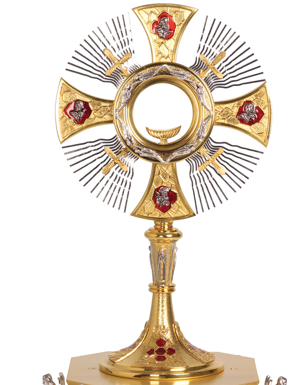 Decorative gold cross with intricate designs on a white background