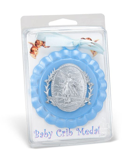 Baby crib medal in packaging with blue border and silver center